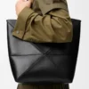 Medium Puzzle Fold tote in shiny calfskin Black Medium Puzzle Fold tote in shiny calfskin Black