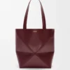 Medium Puzzle Fold tote in shiny calfskin Dark Burgundy Medium Puzzle Fold tote in shiny calfskin Dark Burgundy