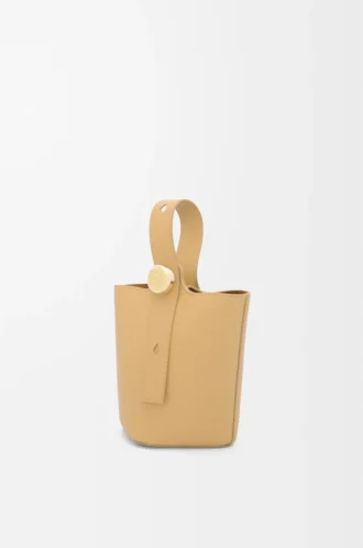 Mini Pebble bucket in smooth calfskin Dark Butter