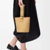 Mini Pebble bucket in smooth calfskin Dark Butter