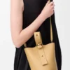 Mini Pebble bucket in smooth calfskin Dark Butter