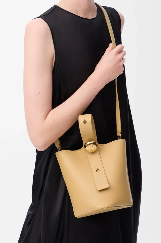 Mini Pebble bucket in smooth calfskin Dark Butter