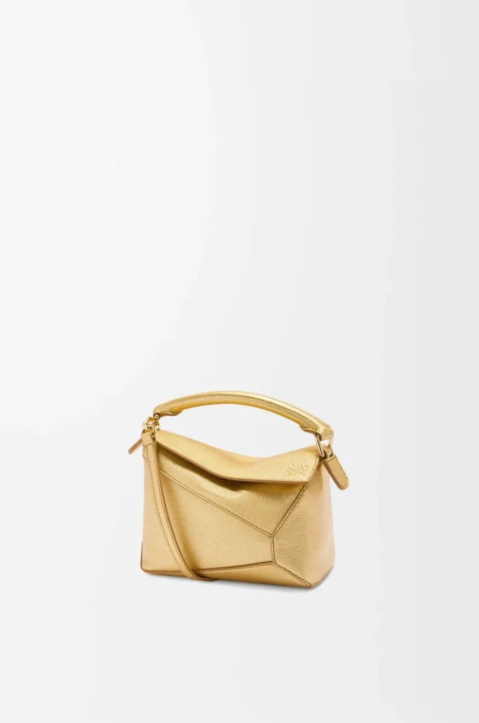 Mini Puzzle Edge bag in laminated lambskin Gold Mini Puzzle Edge bag in laminated lambskin Gold