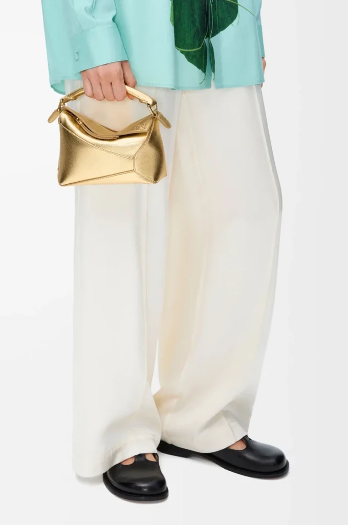 Mini Puzzle Edge bag in laminated lambskin Gold Mini Puzzle Edge bag in laminated lambskin Gold