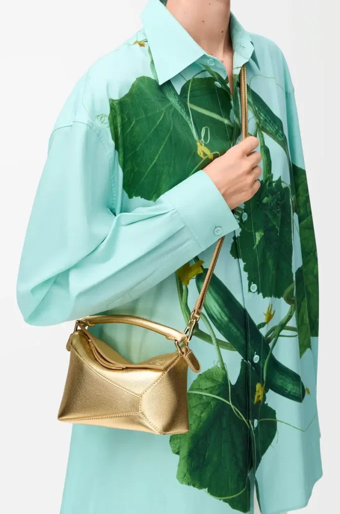 Mini Puzzle Edge bag in laminated lambskin Gold Mini Puzzle Edge bag in laminated lambskin Gold