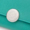 Pebble small vertical wallet in pebble grained calfskin Aquamarine Pebble small vertical wallet in pebble grained calfskin Aquamarine