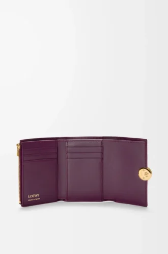 Pebble small vertical wallet in pebble grained calfskin Plum