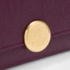 Pebble small vertical wallet in pebble grained calfskin Plum Pebble small vertical wallet in pebble grained calfskin Plum