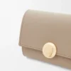 Pebble small vertical wallet in shiny nappa calfskin Sand Pebble small vertical wallet in shiny nappa calfskin Sand