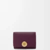 Pebble trifold wallet in pebble grain calfskin Plum Pebble trifold wallet in pebble grain calfskin Plum