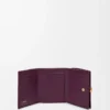 Pebble trifold wallet in pebble grain calfskin Plum Pebble trifold wallet in pebble grain calfskin Plum