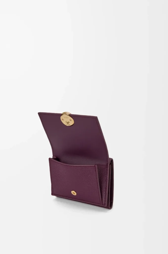 Pebble trifold wallet in pebble grain calfskin Plum Pebble trifold wallet in pebble grain calfskin Plum