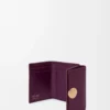 Pebble trifold wallet in pebble grain calfskin Plum Pebble trifold wallet in pebble grain calfskin Plum