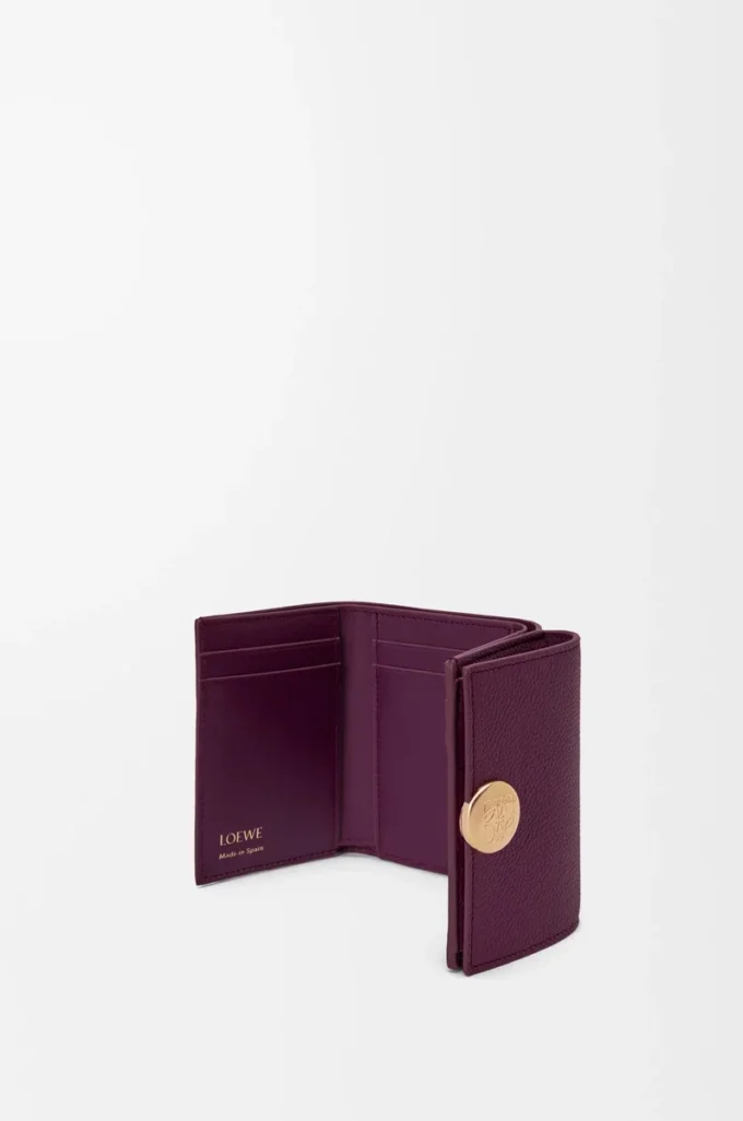 Pebble trifold wallet in pebble grain calfskin Plum Pebble trifold wallet in pebble grain calfskin Plum