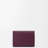 Pebble trifold wallet in pebble grain calfskin Plum Pebble trifold wallet in pebble grain calfskin Plum