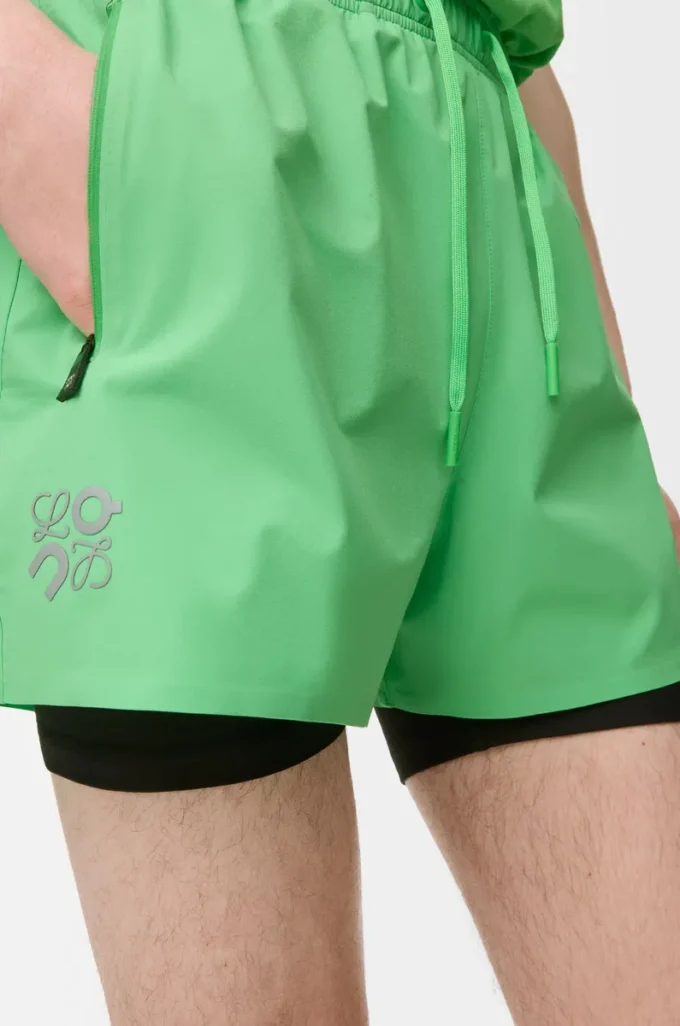 Performance shorts in technical shell Green Performance shorts in technical shell Green
