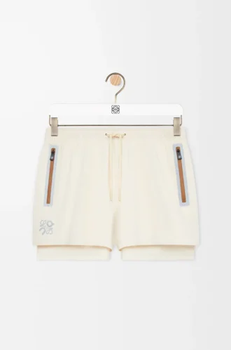 Performance shorts in technical shell Ivory