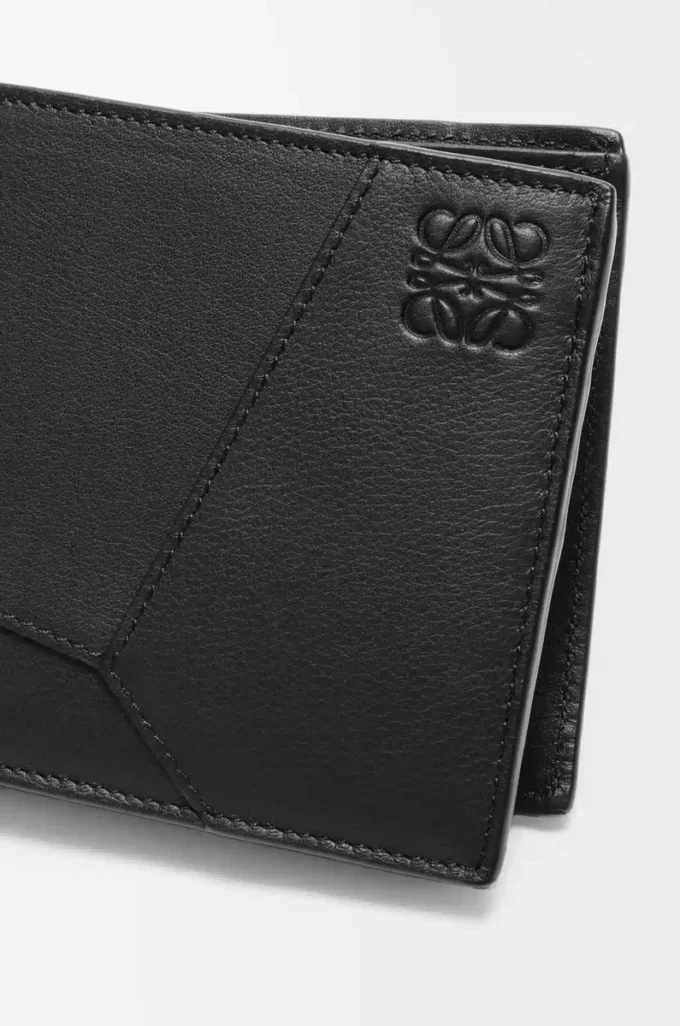 Puzzle bifold coin wallet in classic calfskin Black