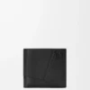 Puzzle bifold coin wallet in supple grained calfskin Black Puzzle bifold coin wallet in supple grained calfskin Black