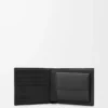 Puzzle bifold coin wallet in supple grained calfskin Black Puzzle bifold coin wallet in supple grained calfskin Black