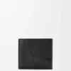 Puzzle bifold coin wallet in supple grained calfskin Black Puzzle bifold coin wallet in supple grained calfskin Black