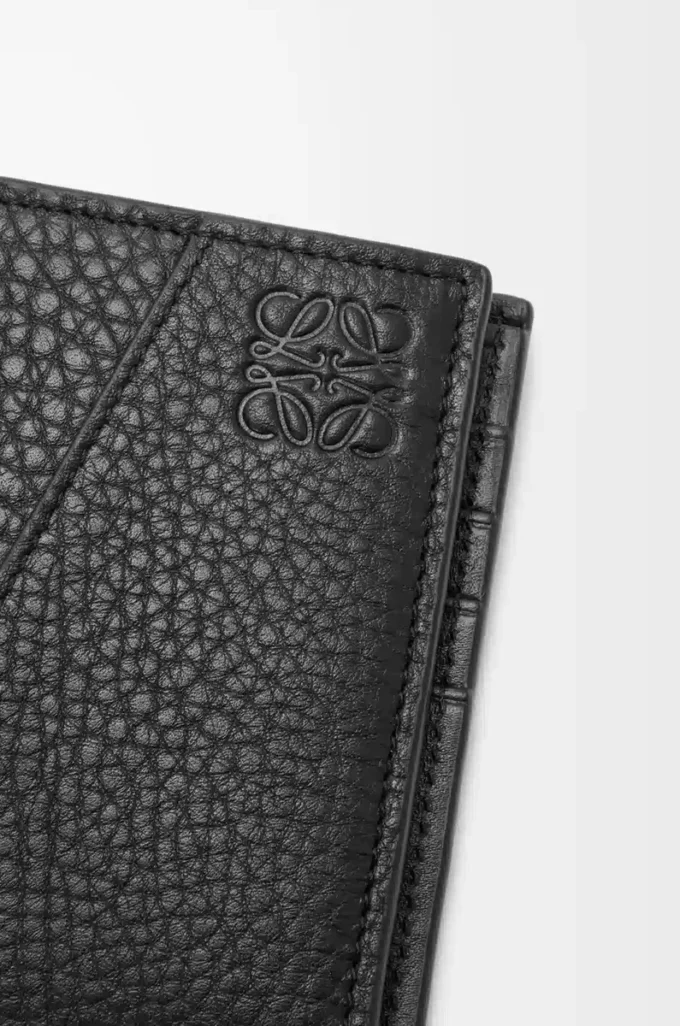 Puzzle bifold coin wallet in supple grained calfskin Black Puzzle bifold coin wallet in supple grained calfskin Black