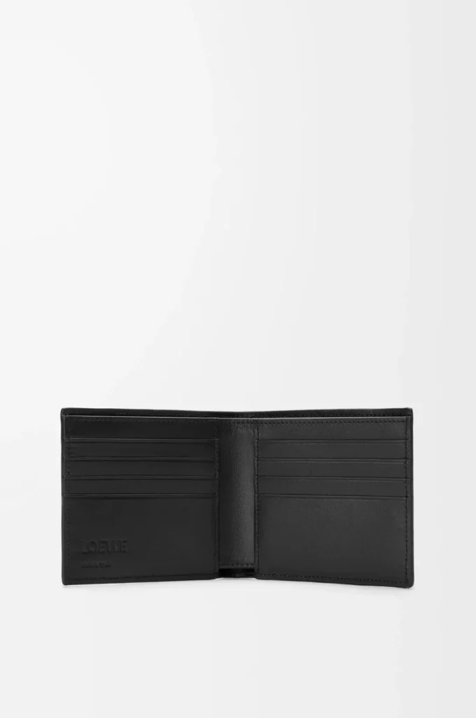 Puzzle bifold wallet in supple grained calfskin Black Puzzle bifold wallet in supple grained calfskin Black