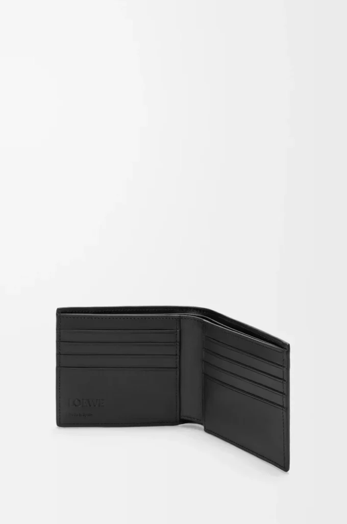 Puzzle bifold wallet in supple grained calfskin Black Puzzle bifold wallet in supple grained calfskin Black