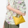 Puzzle Fold pouch in shiny nappa calfskin Dandelion Puzzle Fold pouch in shiny nappa calfskin Dandelion