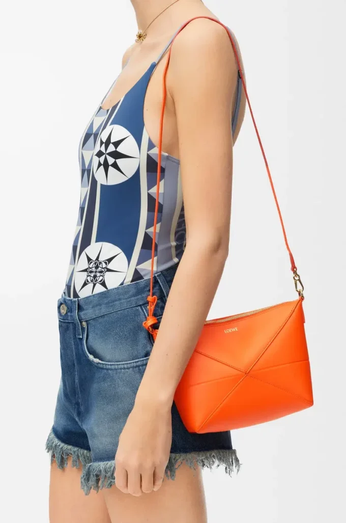 Puzzle Fold pouch in shiny nappa calfskin Vivid Orange Puzzle Fold pouch in shiny nappa calfskin Vivid Orange