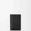 Puzzle passport cover in supple grained calfskin Black