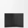 Puzzle passport cover in supple grained calfskin Black