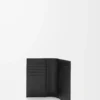 Puzzle passport cover in supple grained calfskin Black