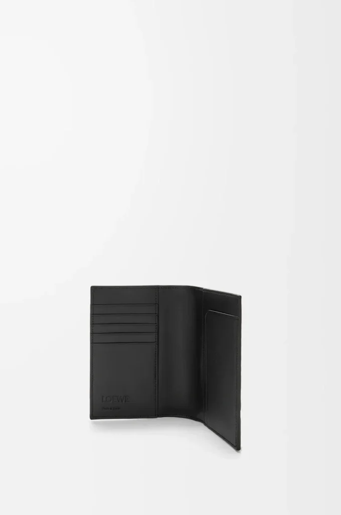 Puzzle passport cover in supple grained calfskin Black