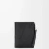 Puzzle slim compact wallet in supple grained calfskin Black Puzzle slim compact wallet in supple grained calfskin Black
