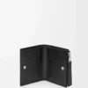 Puzzle slim compact wallet in supple grained calfskin Black Puzzle slim compact wallet in supple grained calfskin Black