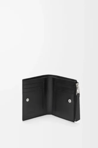 Puzzle slim compact wallet in supple grained calfskin Black