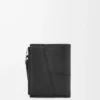 Puzzle slim compact wallet in supple grained calfskin Black Puzzle slim compact wallet in supple grained calfskin Black