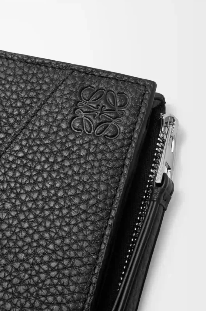 Puzzle slim compact wallet in supple grained calfskin Black Puzzle slim compact wallet in supple grained calfskin Black