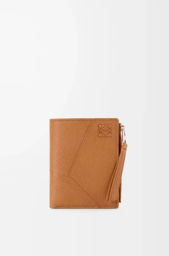 Puzzle slim compact wallet in supple grained calfskin Light Canyon Brown