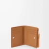 Puzzle slim compact wallet in supple grained calfskin Light Canyon Brown Puzzle slim compact wallet in supple grained calfskin Light Canyon Brown