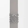 Reversible Anagram belt in smooth calfskin Tan/Asphalt Grey/Pewter Reversible Anagram belt in smooth calfskin Tan/Asphalt Grey/Pewter