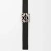 Reversible Anagram Bombé belt in smooth calfskin Black/Burgundy Reversible Anagram Bombé belt in smooth calfskin Black/Burgundy