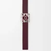 Reversible Anagram Bombé belt in smooth calfskin Black/Burgundy Reversible Anagram Bombé belt in smooth calfskin Black/Burgundy