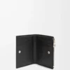 Slim compact wallet in shiny calfskin Black/Deep Navy Slim compact wallet in shiny calfskin Black/Deep Navy