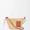 Slit pochette bag in raffia and calfskin Natural/Tan Slit pochette bag in raffia and calfskin Natural/Tan