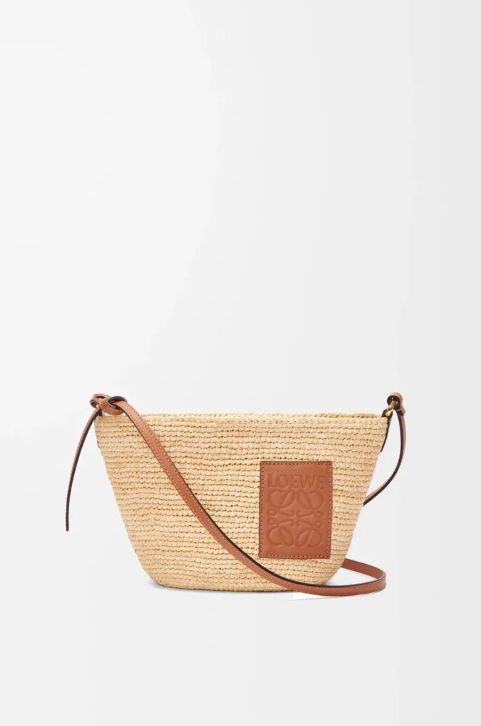 Slit pochette bag in raffia and calfskin Natural/Tan Slit pochette bag in raffia and calfskin Natural/Tan