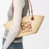 Small Anagram Basket bag in iraca palm and calfskin Natural/Tan Small Anagram Basket bag in iraca palm and calfskin Natural/Tan