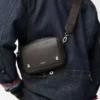 Small Pebble messenger bag in supple grained calfskin Dark Grey