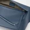 Small Puzzle Edge bumbag in classic calfskin Indigo Dye